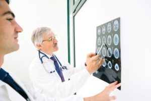 doctors examining mri results