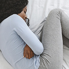 Woman with fibroid pain | Fibroid Treatments